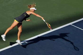 NEW YORK - SEPTEMBER 06:  Caroline Wozniacki of Denmark serves against Maria Sharapova of Russia during the women's singles match on day eight of the 2010 U.S. Open at the USTA Billie Jean King National Tennis Center on September 6, 2010 in the Flushing n