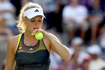 NEW YORK - SEPTEMBER 06:  Caroline Wozniacki of Denmark readies herself to serve against Maria Sharapova of Russia during the women's singles match on day eight of the 2010 U.S. Open at the USTA Billie Jean King National Tennis Center on September 6, 2010