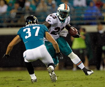 JACKSONVILLE, FL - AUGUST 21:  Ronnie Brown #23 of the Miami Dolphins attempts to run past Sean Considine #37 of the Jacksonville Jaguars during the preseason game at EverBank Field on August 21, 2010 in Jacksonville, Florida.  (Photo by Sam Greenwood/Get
