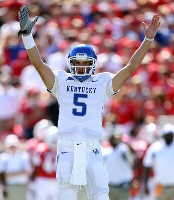 LOUISVILLE, KY - SEPTEMBER 04: Mike Hartline #5 of the Kentucky Wildcats signals for a touchdown during the game against the Louisville Cardinals at Papa John's Cardinal Stadium on September 4, 2010 in Louisville, Kentucky.  (Photo by Andy Lyons/Getty Ima