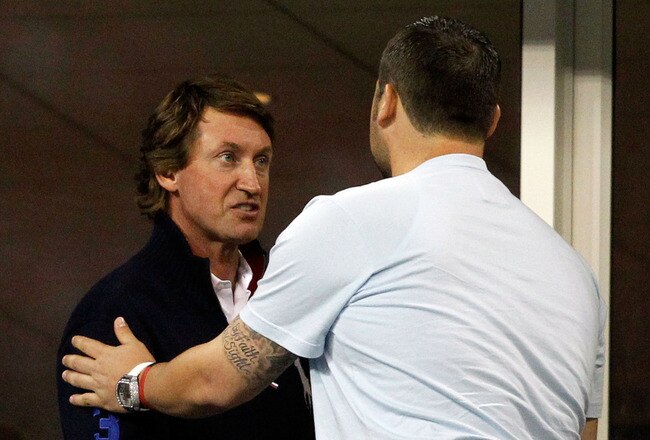 NEW YORK - SEPTEMBER 08:  Wayne Gretzky (L) and Joba Chamberlain look on as Robin Soderling of Sweden plays against Roger Federer of Switzerland during their men's singles quarterfinal match on day ten of the 2010 U.S. Open at the USTA Billie Jean King Na