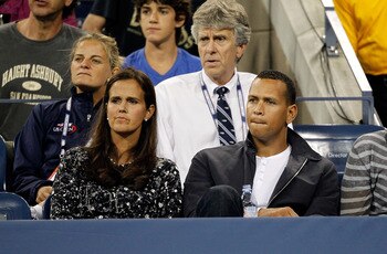 NEW YORK - SEPTEMBER 06:  Television Tennis analyst Mary Jo Fernandez (L) and Alex Rodriguez of the New York Yankees watches Roger Federer of Switzerland hits a return against Jurgen Melzer of Austria during day eight of the 2010 U.S. Open at the USTA Bil