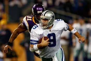 MINNEAPOLIS - JANUARY 17:  Tony Romo #9 of the Dallas Cowboys runs the ball against Ray Edwards #91 of the Minnesota Vikings during the NFC Divisional Playoff Game at Hubert H. Humphrey Metrodome on January 17, 2010 in Minneapolis, Minnesota. The Vikings