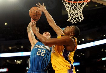 LOS ANGELES, CA - JANUARY 18: Andrew Bynum #17 of the Los Angeles Lakers blocks the shot by Matt Barnes #22 of the Orlando Magic in the third quarter during the game on January 18, 2010 at Staples Center in Los Angeles, California. NOTE TO USER: User expr
