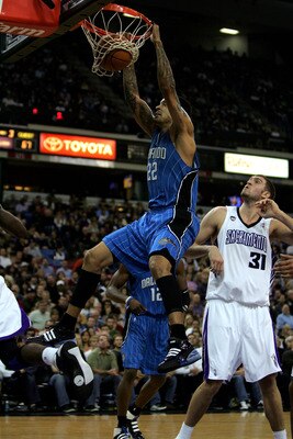 SACRAMENTO, CA - JANUARY 12:  Matt Barnes #22 of the Orlando Magic dunks the ball while Spencer Hawes #31 of the Sacramento Kings looks on at ARCO Arena on January 12, 2010 in Sacramento, California.  NOTE TO USER: User expressly acknowledges and agrees t