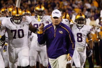BATON ROUGE, LA - NOVEMBER 28:  Head coach Les Miles of the LSU Tigers takes the field before the game against the Arkansa Razorbacks at Tiger Stadium on November 28, 2009 in Baton Rouge, Louisiana.  The Tigers defeated the Razorbacks 33-30 in overtime.