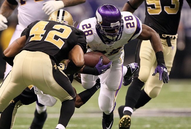 NEW ORLEANS - JANUARY 24:  Adrian Peterson #28 of the Minnesota Vikings runs the ball against the New Orleans Saints during the NFC Championship Game at the Louisiana Superdome on January 24, 2010 in New Orleans, Louisiana.  (Photo by Jed Jacobsohn/Getty 