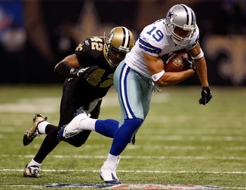 NEW ORLEANS - DECEMBER 19:  Miles Austin #19 of the Dallas Cowboys avoids a tackle by Darren Sharper #42 of the New Orleans Saints at the Louisiana Superdome on December 19, 2009 in New Orleans, Louisiana.  (Photo by Chris Graythen/Getty Images)