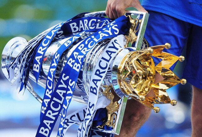LONDON, ENGLAND - MAY 09:  Joe Cole of Chelsea celebrates with the trophy as they win the title after the Barclays Premier League match between Chelsea and Wigan Athletic at Stamford Bridge on May 9, 2010 in London, England. Chelsea won 8-0 to win the cha