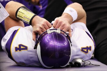 NEW ORLEANS - JANUARY 24:  Brett Favre #4 of  the Minnesota Vikings is checked on by medical staff after getting injured on a play against the New Orleans Saints during the NFC Championship Game at the Louisiana Superdome on January 24, 2010 in New Orlean