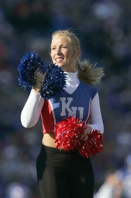 LAWRENCE, KS - NOVEMBER 18: A cheerleader of the Kansas Jayhawks stands on the field during the game against the Kansas State Wildcats at Memorial Stadium on November 18, 2006 in Lawrence, Kansas. The Kansas Jayhawks won 39-20. (Photo by Brian Bahr/Getty