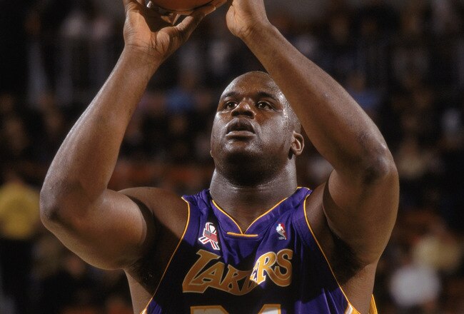 30 Nov 2001:  Center Shaquille O''Neal #34 of the Los Angeles Lakers shoots a free throw during the NBA game against the Seattle SuperSonics at Key Arena in Seattle, Washington.  The Lakers defeated the SuperSonics 107-92.  Mandatory Credit: Otto Greule/G