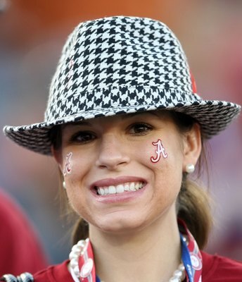 PASADENA, CA - JANUARY 07:  A fan of the Alabama Crimson Tide stands inside the stadium prior to the game against the Texas Longhorns in the Citi BCS National Championship game at the Rose Bowl on January 7, 2010 in Pasadena, California.  (Photo by Stephe