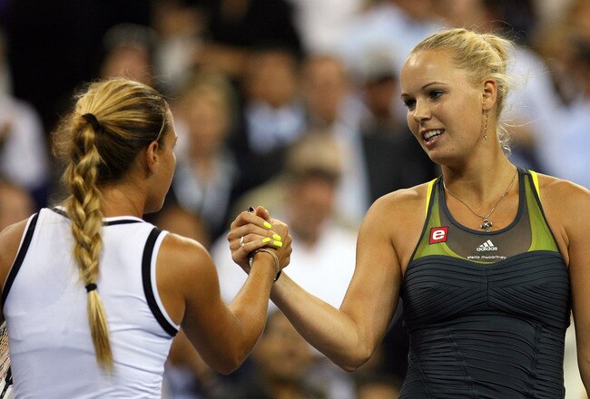 NEW YORK - SEPTEMBER 08:  Caroline Wozniacki of Denmark shakes hands with  Dominika Cibulkova of Slovakia after their women's single quarterfinal match during day ten of the 2010 U.S. Open at the USTA Billie Jean King National Tennis Center on September 8