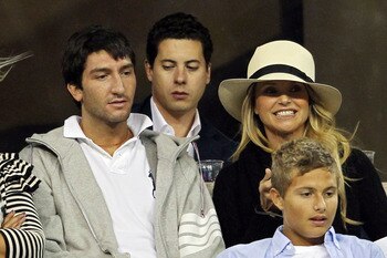 NEW YORK - SEPTEMBER 09:  Evan Lysacek and Christie Brinkley looks on as Rafael Nadal of Spain plays against Fernando Verdasco of Spain during his men's single quarterfinal match on day eleven of the 2010 U.S. Open at the USTA Billie Jean King National Te