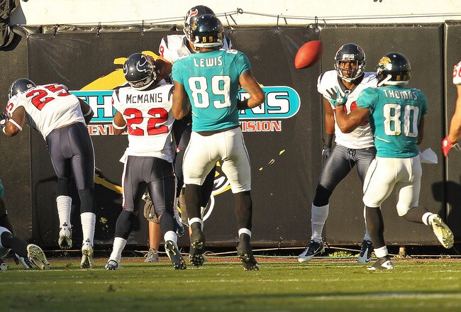 JACKSONVILLE, FL - NOVEMBER 14:  Mike Thomas #80 of the Jacksonville Jaguars catches a tipped pass winning a game against the Houston Texans at EverBank Field on November 14, 2010 in Jacksonville, Florida.  (Photo by Mike Ehrmann/Getty Images)