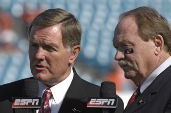 JACKSONVILLE, FL - DECEMBER 1: ESPN commentators Bob Griese (left) and Paul Maguire report from the sidelines as the Boston College Eagles battle the Virginia Tech Hokies in the ACC Championship Game at Jacksonville Municipal Stadium on December 1, 2007 i