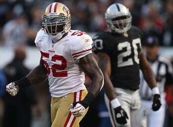 OAKLAND, CA - AUGUST 28: Patrick Willis #52 of the San Francisco 49ers celebrates after stopping Darren McFadden #20 of the Oakland Raiders for a loss during an NFL preseason game at Oakland-Alameda County Coliseum on August 28, 2010 in Oakland, Californi