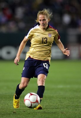 CARSON, CA - DECEMBER 13:  Kristine Lilly #13 of the USA passes the ball during their international friendly match against China at The Home Depot Center on December 13, 2008 in Carson, California. The USA defeated China 1-0.  (Photo by Victor Decolongon/