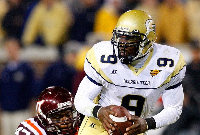 ATLANTA - OCTOBER 17:  Quarterback Josh Nesbitt #9 of the Georgia Tech Yellow Jackets rushes upfield away from Nekos Brown #47 of the Virginia Tech Hokies at Bobby Dodd Stadium on October 17, 2009 in Atlanta, Georgia.  (Photo by Kevin C. Cox/Getty Images)
