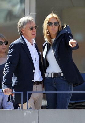 NEW YORK - SEPTEMBER 11:  (L-R) Tommy Hilfiger and his wife Dee Ocleppo attend the men's singles semifinal match between Rafael Nadal of Spain and Mikhail Youzhny of Russia during day thirteen of the 2010 U.S. Open at the USTA Billie Jean King National Te