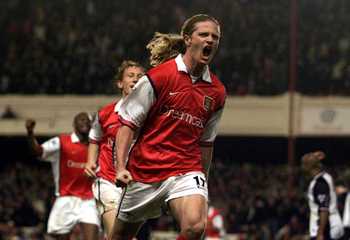 2 May 2000:  Emmanuel Petit of Arsenal celebrates scoring the winning goal in the last minute during the match between Arsenal and West Ham United in the FA Carling Premiership at Highbury, London.  Mandatory Credit: Laurence Griffiths/ALLSPORT