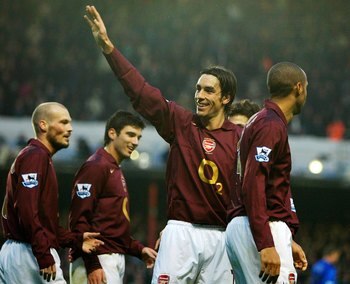 LONDON - JANUARY 14:  Robert Pires of Arsenal is congratulated by team mates after scoring the fourth goal of the game during the Barclays Premiership match between Arsenal and Middlesbrough at Highbury on January 14, 2006 in London, England.  (Photo by R