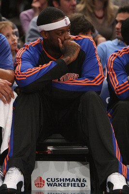 NEW YORK - DECEMBER 07:  Eddy Curry #34 of the New York Knicks sits with teammate Nate Robinson #2 on the bench during NBA action against the Portland Trail Blazers at Madison Square Garden on December 7, 2009 in New York, New York. NOTE TO USER: User exp
