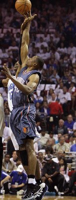 ORLANDO, FL - APRIL 18:  Theo Ratliff #42 of the Charlotte Bobcats gets the opening tip over Dwight Howard #12 of the Orlando Magic after being tossed into the air by official Dan Crawford  #43 in Game One of the Eastern Conference Quarterfinals during th
