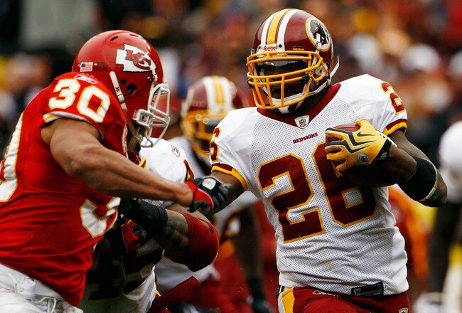 LANDOVER, MD - OCTOBER 18:  Mike Brown #30 of the Kansas City Chiefs tackles Clinton Portis #26 of the Washington Redskins during their game October 18, 2009 at FedEx Field in Landover, Maryland.The Chiefs won the game 14-6.  (Photo by Win McNamee/Getty I