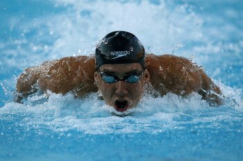 IRVINE, CA - AUGUST 20:  Michael Phelps swims on his way to winning the men's 100m butterfly during the Mutual of Omaha Pan Pacific Championships at the William Woollett Jr. Aquatic Center on August 20, 2010 in Irvine, California.  (Photo by Stephen Dunn/