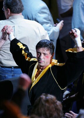 LAS VEGAS - DECEMBER 03:  Actor Sylvester Stallone waves to the crowd as scenes from the film 'Rocky VI' are filmed before the start of the Bernard Hopkins and Jermain Taylor fight at the Mandalay Bay Events Center on December 3, 2005 in Las Vegas, Nevada