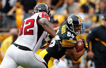 PITTSBURGH - SEPTEMBER 12: Hines Ward #86 of the Pittsburgh Steelers runs by Chauncey Davis #92 of the Atlanta Falcons after catching a pass during the NFL season opener game on September 12, 2010 at Heinz Field in Pittsburgh, Pennsylvania.  (Photo by Jar