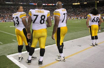 DENVER - AUGUST 29:  Offensive linemen Maurkice Pouncey #53, Max Starks #78, Flozell Adams #71 and Chris Kemoeatu #68 of the Pittsburgh Steelers watch from the sideline as they prepare for action against the Denver Broncos during preseason NFL action at I