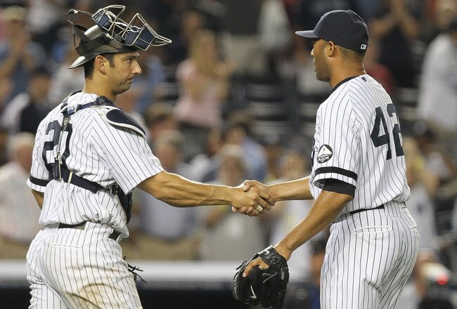 NEW YORK - AUGUST 18:  Mariano Rivera #42 of the New York Yankees celebrates the win with catcher Jorge Posada #20 against the Detroit Tigers at Yankee Stadium on August 18, 2010 in the Bronx borough of New York City.  (Photo by Nick Laham/Getty Images)