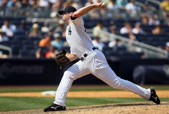 NEW YORK - JULY 18:  Boone Logan #48 of the New York Yankees delivers a pitch against the Tampa Bay Rays on July 18, 2010 at Yankee Stadium in the Bronx borough of New York City. The Yankees defeated the Rays 9-5.  (Photo by Jim McIsaac/Getty Images)