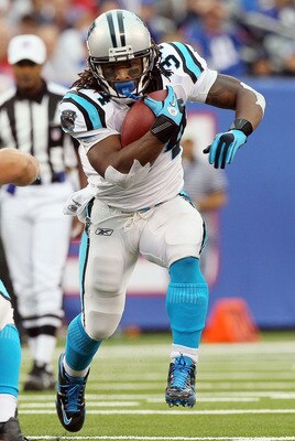 EAST RUTHERFORD, NJ - SEPTEMBER 12:  DeAngelo Williams #34 of the Carolina Panthers runs the ball in the first half against the New York Giants on September 12, 2010 at the New Meadowlands Stadium in East Rutherford, New Jersey.  (Photo by Jim McIsaac/Get