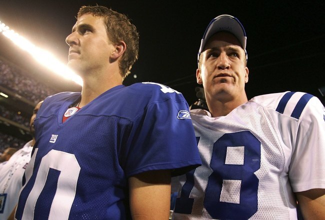 EAST RUTHERFORD, NJ - SEPTEMBER 10:  Quarterback Eli Manning #10 of the New York Giants (L) congratulates his brother quarterback Peyton Manning #18 of the Indianapolis Colts on his 26-21 victory on September 10, 2006 at Giants Stadium in East Rutherford,