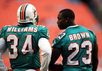 MIAMI - AUGUST 23: Running backs Ricky Williams #34 and Ronnie Brown #23 of the Miami Dolphins chat prior to a preseason game against the Kansas City Chiefs on August 23, 2008 at Dolphin Stadium in Miami, Florida.  (Photo by Marc Serota/Getty Images)
