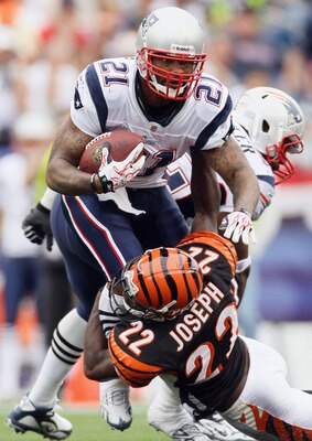 FOXBORO, MA - SEPTEMBER 12:  Fred Taylor #21 of the New England Patriots is tackled by Johnathan Joseph #22 of the Cincinnati Bengals during the NFL season opener on September 12, 2010 at Gillette Stadium in Foxboro, Massachusetts. The Patriots defeated t