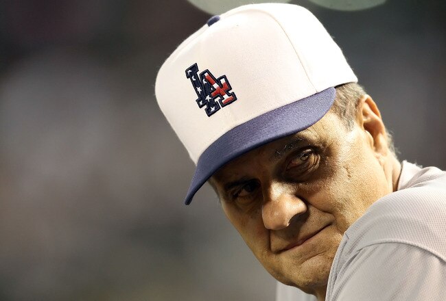 PHOENIX - JULY 03:  Manager Joe Torre #6 of the Los Angeles Dodgers looks on from the dugout during the Major League Baseball game against the Arizona Diamondbacks at Chase Field on July 3, 2010 in Phoenix, Arizona.  (Photo by Christian Petersen/Getty Ima
