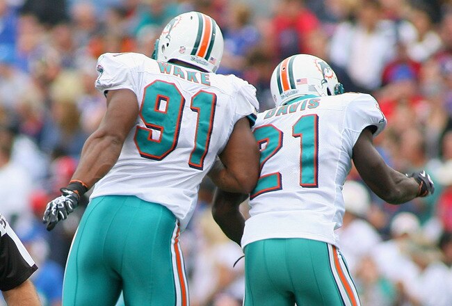 ORCHARD PARK, NY - SEPTEMBER 12: Cameron Wake #91 and Vontae Davis #21 of the Miami Dolphins celebrate a sack against the Buffalo Bills  during the NFL season opener at Ralph Wilson Stadium on September 12, 2010 in Orchard Park, New York.  Miami won 15-10