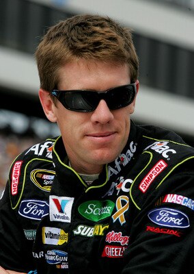 LOUDON, NH - SEPTEMBER 19:  Carl Edwards, driver of the #99 Aflac Ford, stands on the grid during the NASCAR Sprint Cup Series Sylvania 300 at New Hampshire Motor Speedway on September 19, 2010 in Loudon, New Hampshire.  (Photo by Jerry Markland/Getty Ima