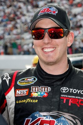 LOUDON, NH - SEPTEMBER 18:  Kyle Busch, driver of the #18 Toyota Tundra Toyota, smiles on the grid prior to the start of the NASCAR Camping World Truck Series TheRaceDayRaffleSeries.com 175 at the New Hampshire Motor Speedway on September 18, 2010 in Loud