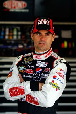 LOUDON, NH - SEPTEMBER 18:  Jeff Gordon, driver of the #24 DuPont / National Guard Facebook Chevrolet, looks on in the garage during practice for the NASCAR Sprint Cup Series Sylvania 300 at New Hampshire Motor Speedway on September 18, 2010 in Loudon, Ne