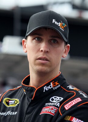 LOUDON, NH - SEPTEMBER 18:  Denny Hamlin, driver of the #11 FedEx Small Business Toyota, looks on during practice for the NASCAR Sprint Cup Series Sylvania 300 at New Hampshire Motor Speedway on September 18, 2010 in Loudon, New Hampshire.  (Photo by Elsa