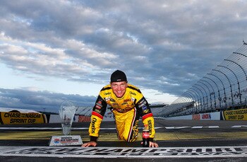 LOUDON, NH - SEPTEMBER 19:  Clint Bowyer, driver of the #33 Cheerios / Hamburger Helper Chevrolet, poses at the start/finish line after he won the NASCAR Sprint Cup Series Sylvania 300 at New Hampshire Motor Speedway on September 19, 2010 in Loudon, New H