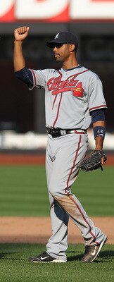 NEW YORK - SEPTEMBER 19: Derek Lee #27 of the Atlanta Braves celebrates the win with teammate Martin Prado #14 against the New York Mets at Citi Field on September 19, 2010 in the Flushing neighborhood of the Queens borough of New York City.  (Photo by Ni