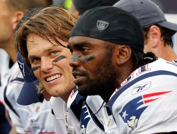FOXBORO, MA - SEPTEMBER 12: Quarterback Tom Brady #12 and Randy Moss #81 of the New England Patriots take a breather on the bench during the NFL season opener against the Cincinnati Bengals at Gillette Stadium on September 12, 2010 in Foxboro, Massachuset