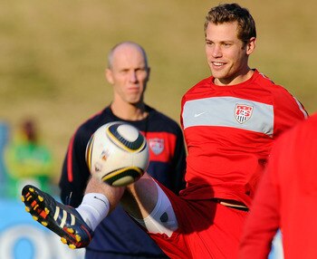 PRETORIA, SOUTH AFRICA - JUNE 24: Jonathan Spector of USA controls the ball as head coach Bob Bradley looks during training session on June 24, 2010 in Pretoria, South Africa. United States will play their second round World Cup match against Ghana on Sat